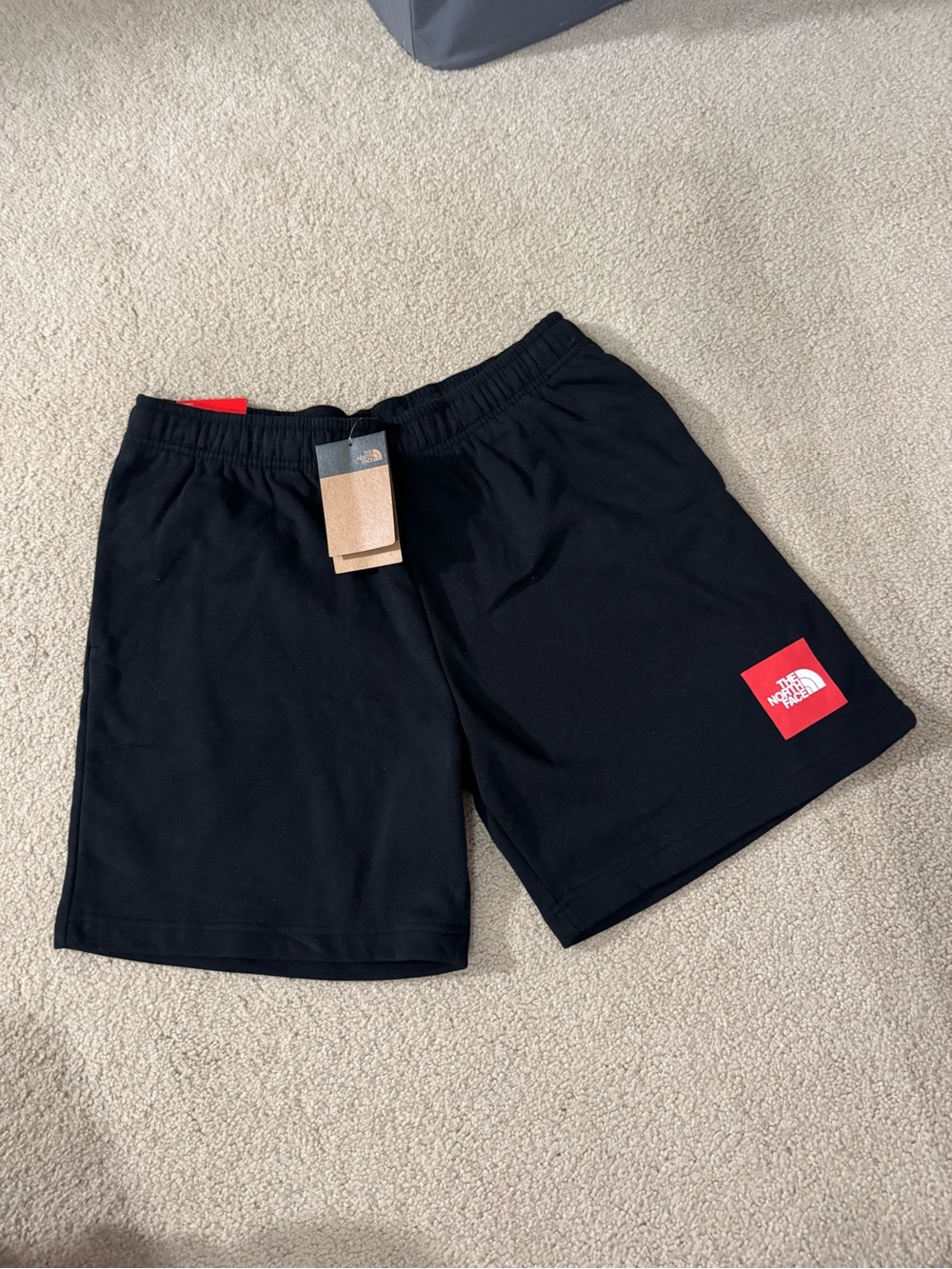 The North Face Men's Black Athletic Shorts with Red Logo Patch